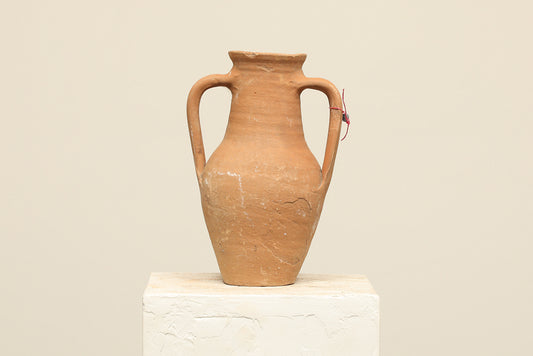 A one-of-a-kind natural Turkish vintage vase pot with two handles, crafted from terra cotta clay, this piece showcases timeless quality and antique craftsmanship, adding a unique touch of history to your space
