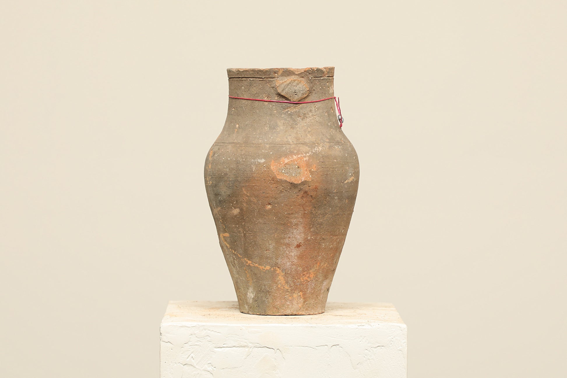 A one-of-a-kind natural Turkish vintage vase pot without a handle, crafted from terra cotta clay, this piece showcases timeless quality and antique craftsmanship, adding a unique touch of history to your space