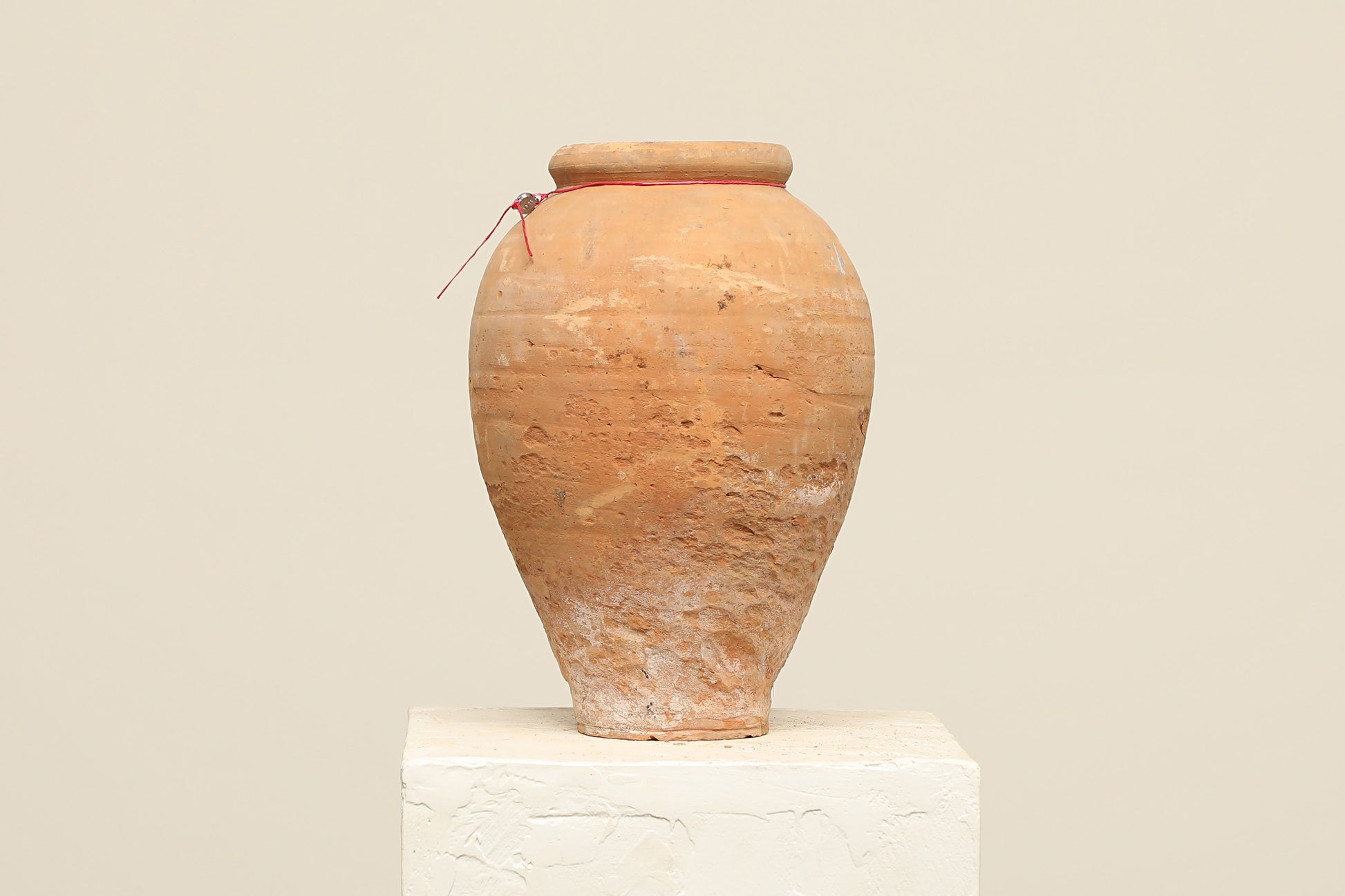 A one-of-a-kind natural Turkish vintage vase pot without a handle, crafted from terra cotta clay, this piece showcases timeless quality and antique craftsmanship, adding a unique touch of history to your space