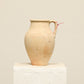 A one-of-a-kind neutral Turkish vintage vase pot with a handle, crafted from terra cotta clay, this piece showcases timeless quality and antique craftsmanship, adding a unique touch of history to your space