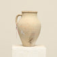 A one-of-a-kind neutral Turkish vintage vase pot with a handle, crafted from terra cotta clay, this piece showcases timeless quality and antique craftsmanship, adding a unique touch of history to your space