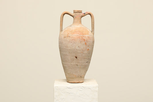 A one-of-a-kind neutral Turkish vintage vase pot with two handles, crafted from terra cotta clay, this piece showcases timeless quality and antique craftsmanship, adding a unique touch of history to your space