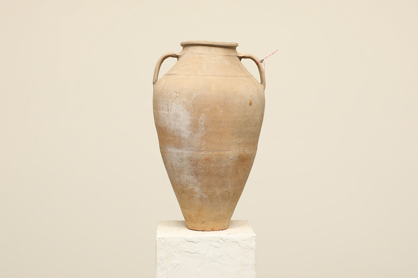 A one-of-a-kind neutral Turkish vintage vase pot with two handles, crafted from terra cotta clay, this piece showcases timeless quality and antique craftsmanship, adding a unique touch of history to your space