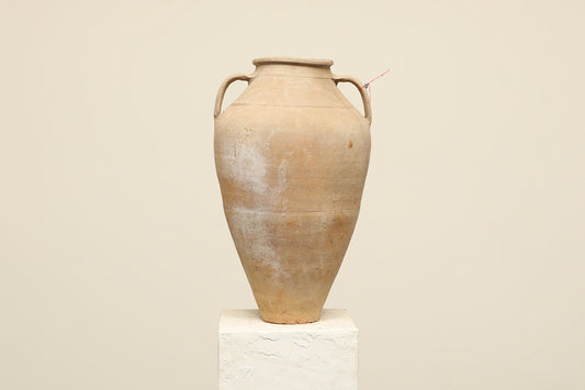 A one-of-a-kind neutral Turkish vintage vase pot with two handles, crafted from terra cotta clay, this piece showcases timeless quality and antique craftsmanship, adding a unique touch of history to your space