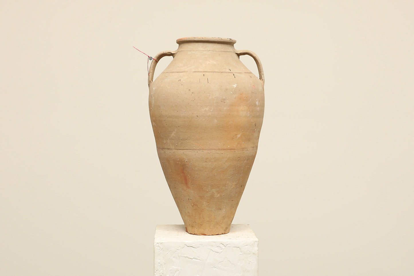A one-of-a-kind neutral Turkish vintage vase pot with two handles, crafted from terra cotta clay, this piece showcases timeless quality and antique craftsmanship, adding a unique touch of history to your space
