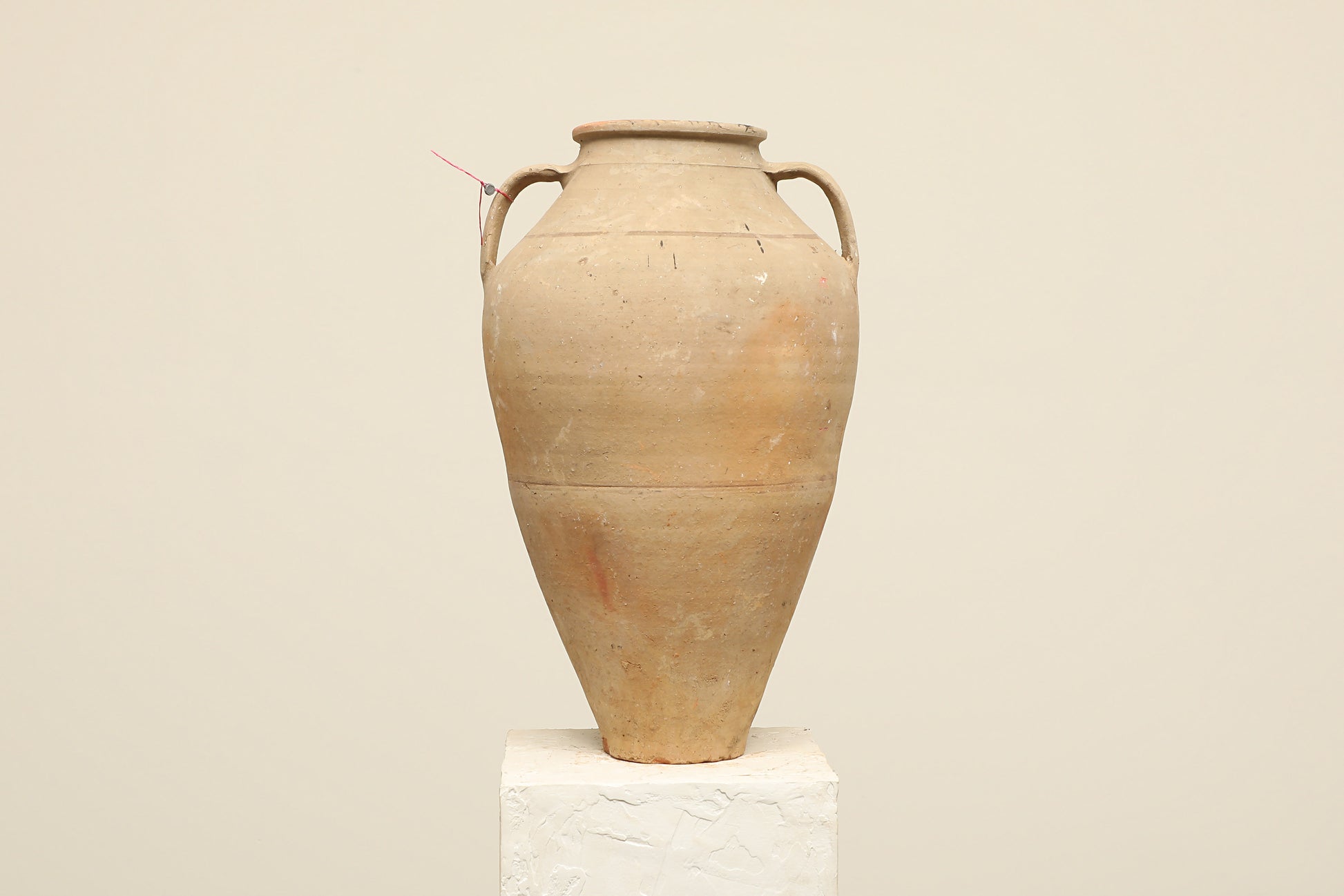 A one-of-a-kind neutral Turkish vintage vase pot with two handles, crafted from terra cotta clay, this piece showcases timeless quality and antique craftsmanship, adding a unique touch of history to your space