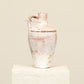 A one-of-a-kind off white Turkish vintage vase pot with a handle, crafted from terra cotta clay, this piece showcases timeless quality and antique craftsmanship, adding a unique touch of history to your space