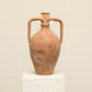 A one-of-a-kind rustic red Turkish vintage vase pot with two handles, crafted from terra cotta clay, this piece showcases timeless quality and antique craftsmanship, adding a unique touch of history to your space
