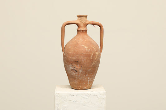 A one-of-a-kind rustic red Turkish vintage vase pot with two handles, crafted from terra cotta clay, this piece showcases timeless quality and antique craftsmanship, adding a unique touch of history to your space