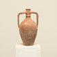 A one-of-a-kind rustic red Turkish vintage vase pot with two handles, crafted from terra cotta clay, this piece showcases timeless quality and antique craftsmanship, adding a unique touch of history to your space