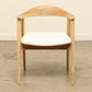 Teak wood Harlow dining chair with a cushioned seat.