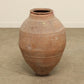 A one-of-a-kind clay brown Turkish vintage vase pot without a handle, crafted from terra cotta clay, this piece showcases timeless quality and antique craftsmanship, adding a unique touch of history to your space