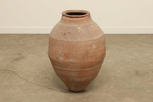 A one-of-a-kind clay brown Turkish vintage vase pot without a handle, crafted from terra cotta clay, this piece showcases timeless quality and antique craftsmanship, adding a unique touch of history to your space