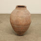 A one-of-a-kind clay brown Turkish vintage vase pot without a handle, crafted from terra cotta clay, this piece showcases timeless quality and antique craftsmanship, adding a unique touch of history to your space