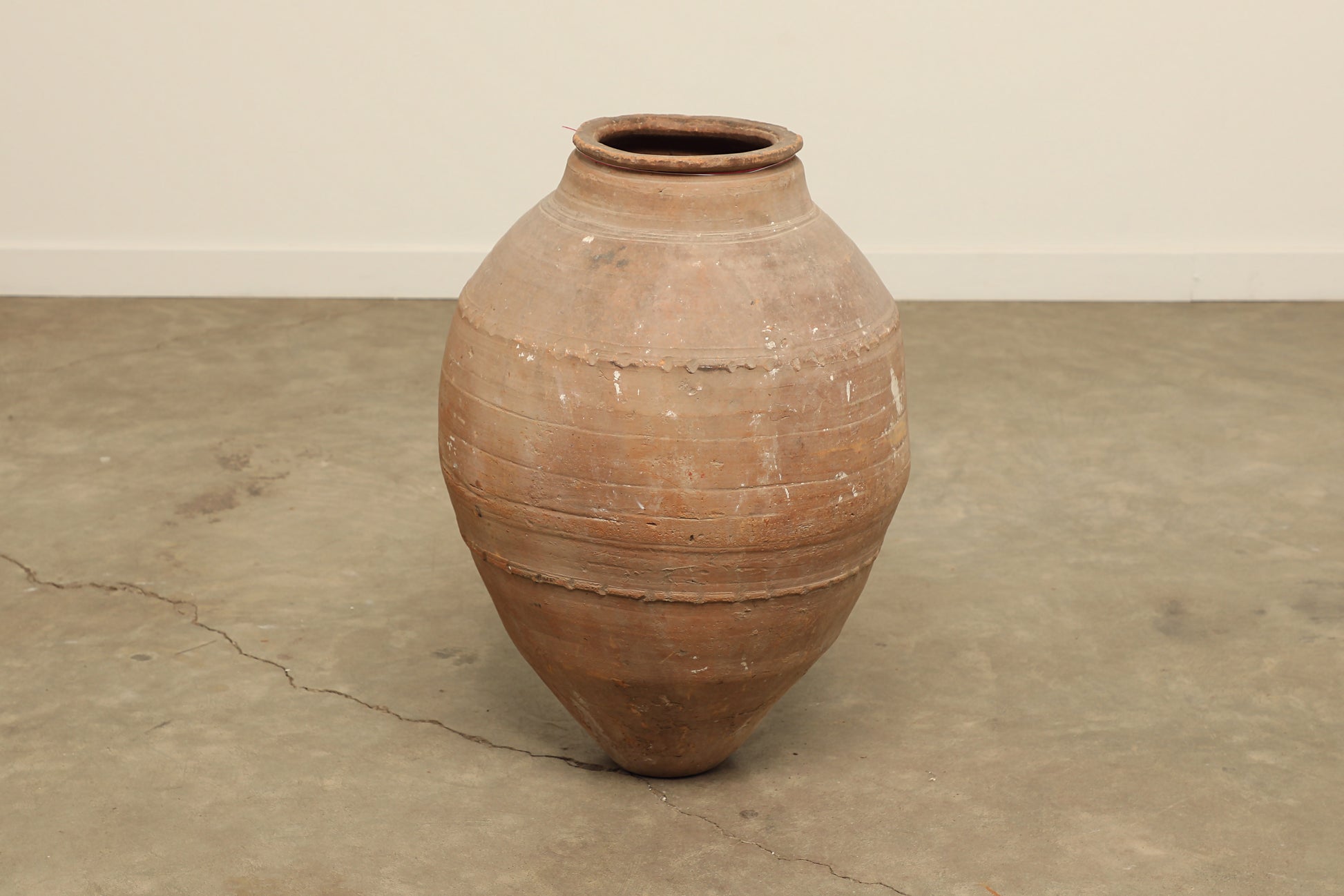 A one-of-a-kind clay brown Turkish vintage vase pot without a handle, crafted from terra cotta clay, this piece showcases timeless quality and antique craftsmanship, adding a unique touch of history to your space