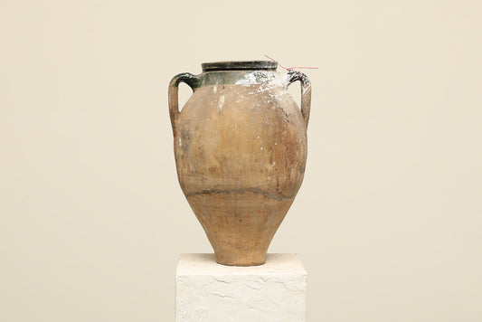 A one-of-a-kind dark brown Turkish vintage vase pot with two handles, crafted from terra cotta clay, this piece showcases timeless quality and antique craftsmanship, adding a unique touch of history to your space