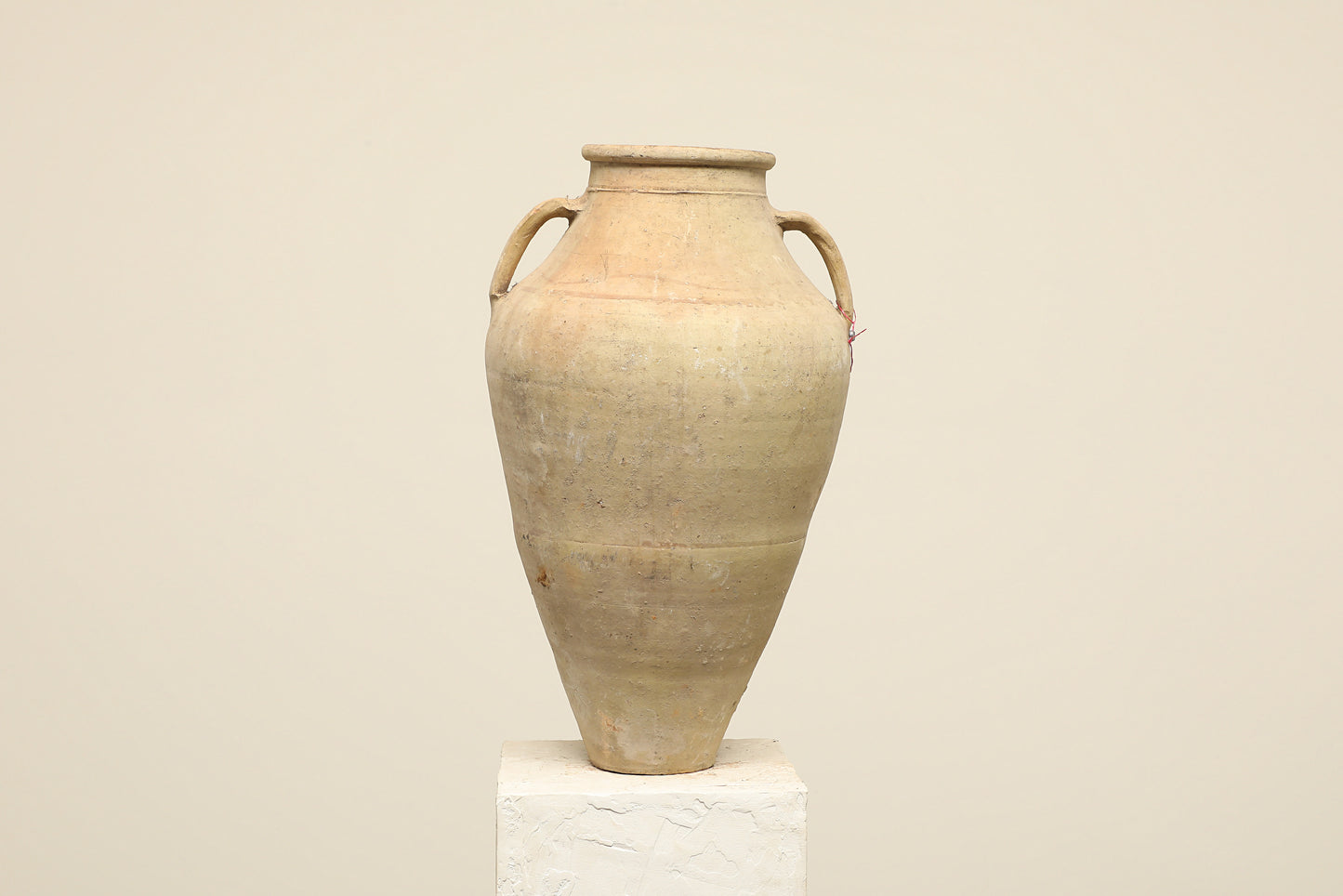 A one-of-a-kind neutral Turkish vintage vase pot with two handles, crafted from terra cotta clay, this piece showcases timeless quality and antique craftsmanship, adding a unique touch of history to your space