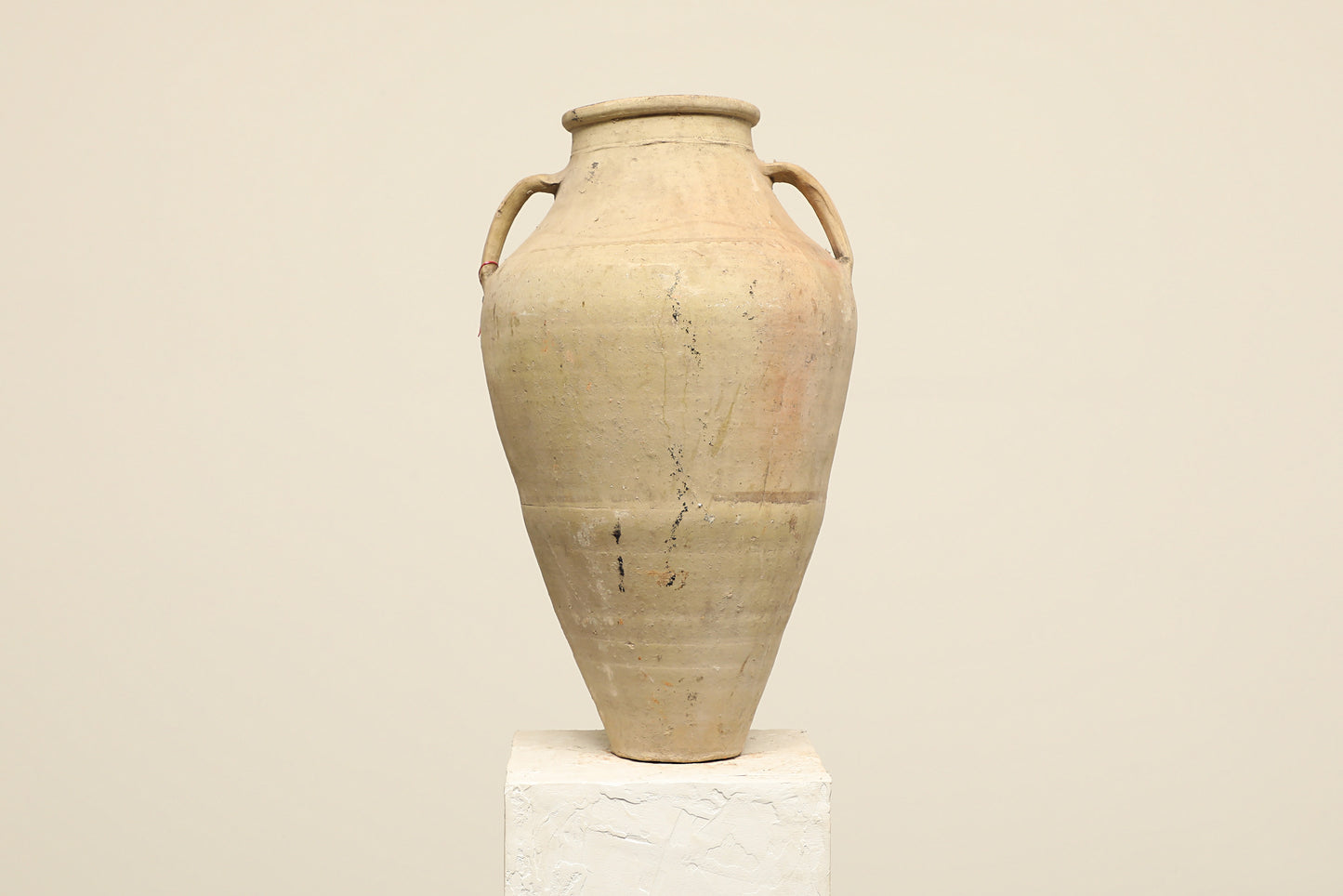 A one-of-a-kind neutral Turkish vintage vase pot with two handles, crafted from terra cotta clay, this piece showcases timeless quality and antique craftsmanship, adding a unique touch of history to your space