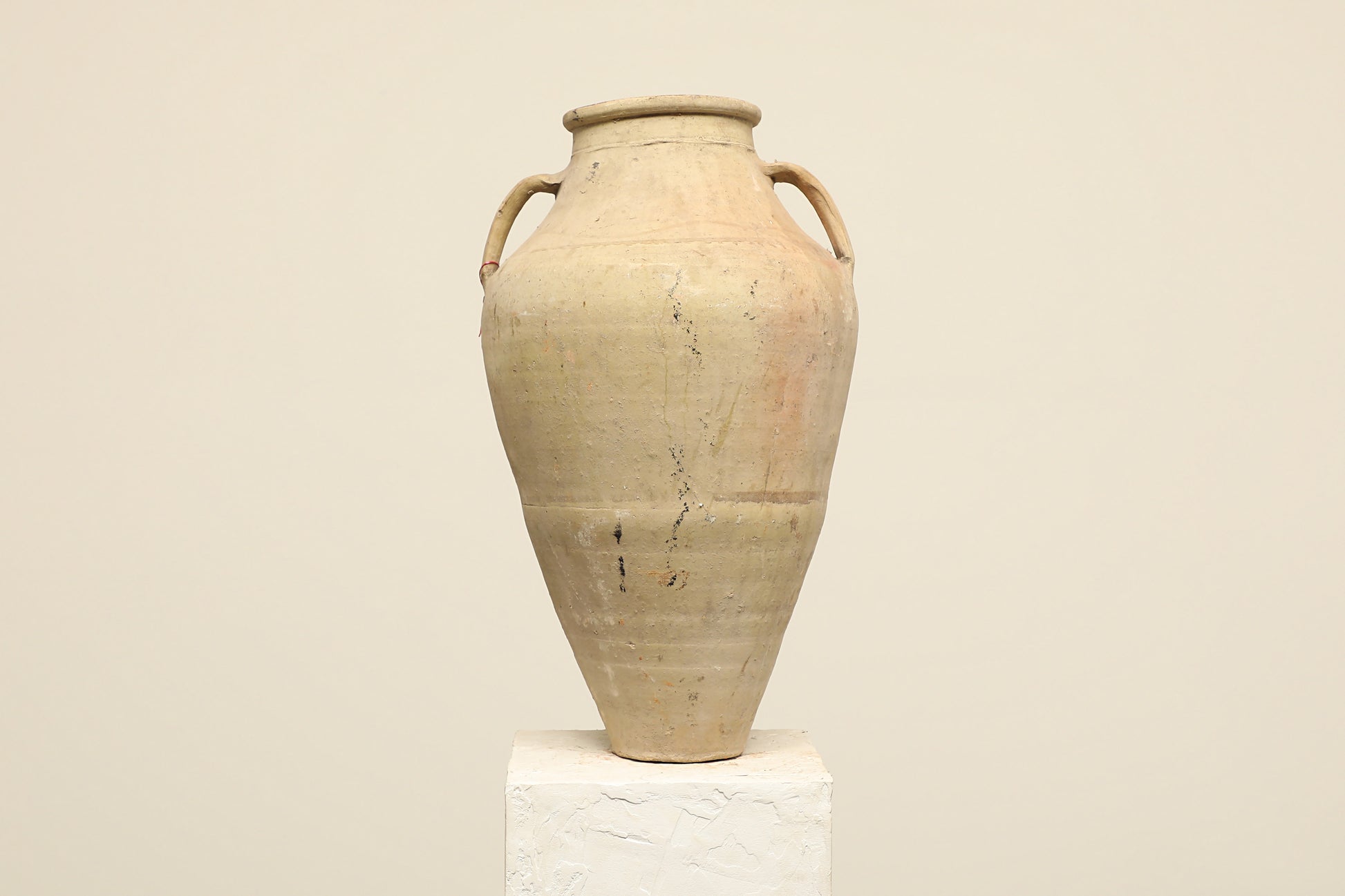A one-of-a-kind neutral Turkish vintage vase pot with two handles, crafted from terra cotta clay, this piece showcases timeless quality and antique craftsmanship, adding a unique touch of history to your space