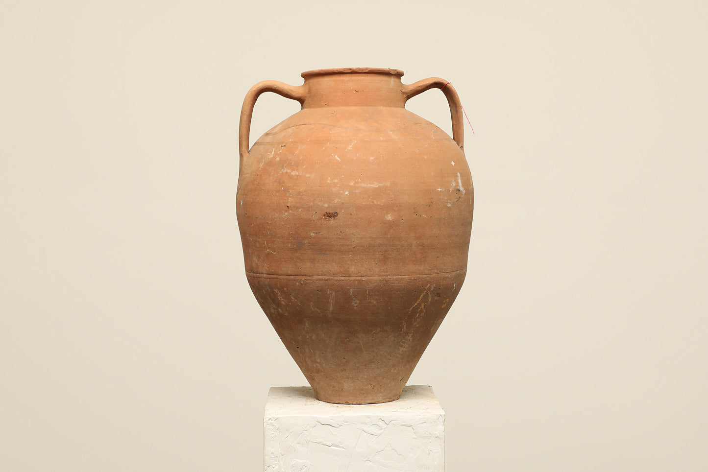 A one-of-a-kind rustic red Turkish vintage vase pot with two handles, crafted from terra cotta clay, this piece showcases timeless quality and antique craftsmanship, adding a unique touch of history to your space