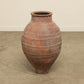 A one-of-a-kind dark brown Turkish vintage vase pot without a handle, crafted from terra cotta clay, this piece showcases timeless quality and antique craftsmanship, adding a unique touch of history to your space