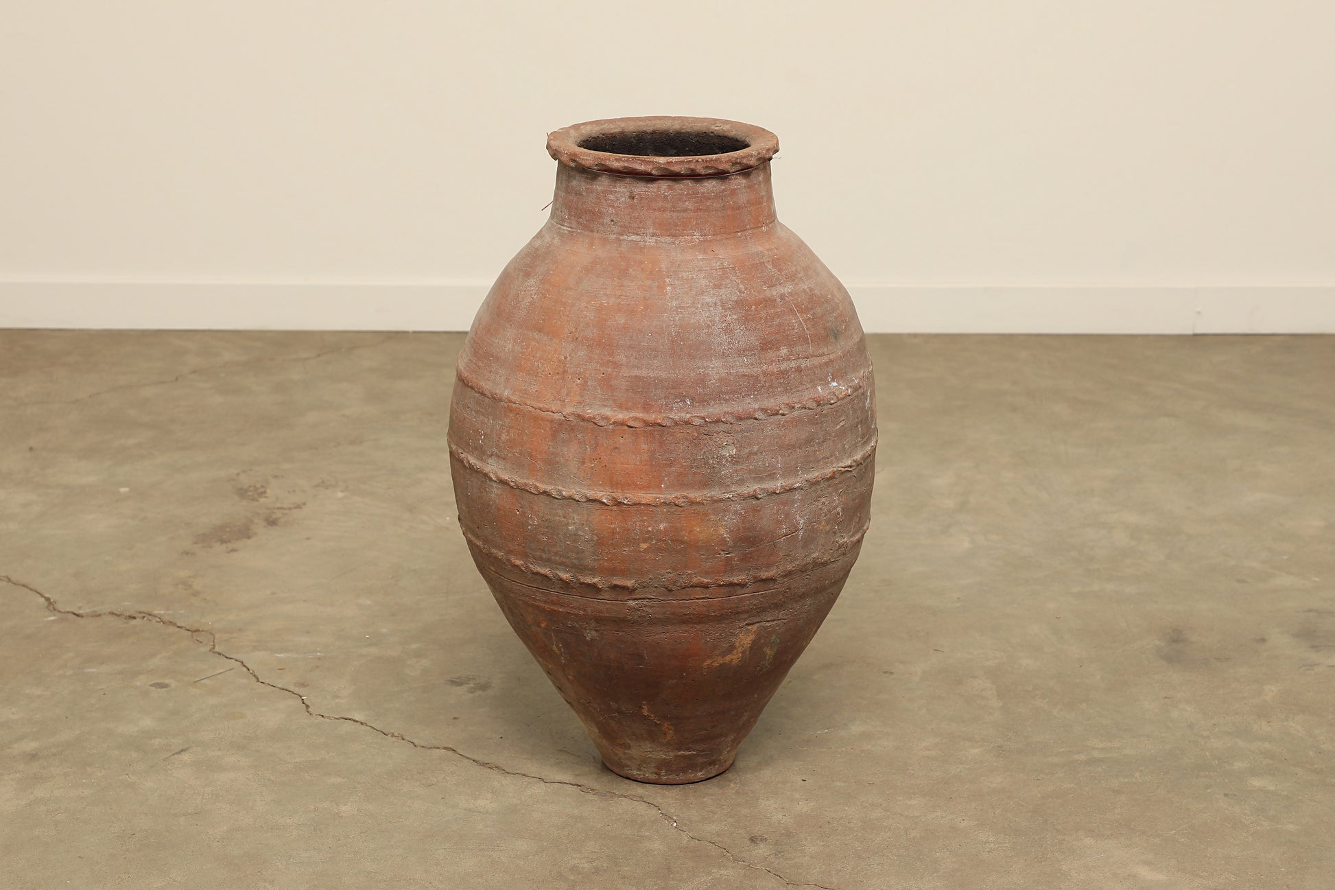 A one-of-a-kind dark brown Turkish vintage vase pot without a handle, crafted from terra cotta clay, this piece showcases timeless quality and antique craftsmanship, adding a unique touch of history to your space