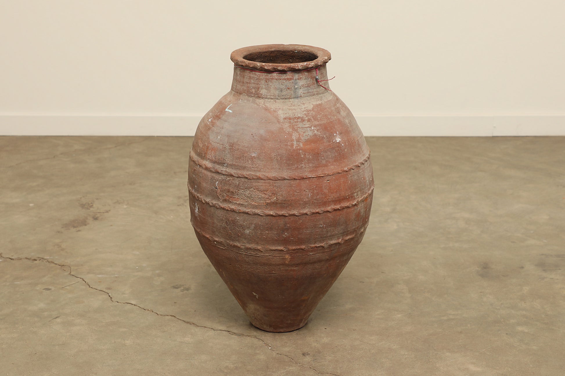 A one-of-a-kind dark brown Turkish vintage vase pot without a handle, crafted from terra cotta clay, this piece showcases timeless quality and antique craftsmanship, adding a unique touch of history to your space