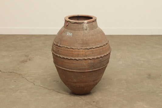 A one-of-a-kind clay brown Turkish vintage vase pot without a handle, crafted from terra cotta clay, this piece showcases timeless quality and antique craftsmanship, adding a unique touch of history to your space