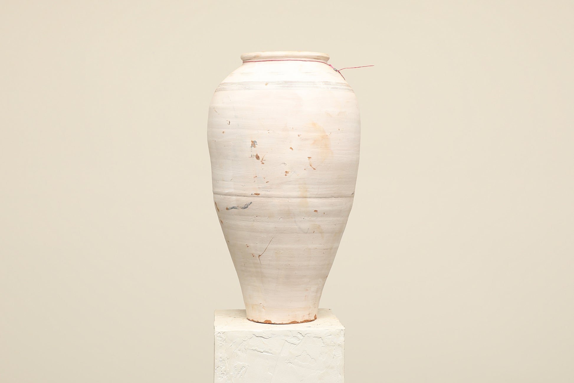 A one-of-a-kind white Turkish vintage vase pot without a handle, crafted from terra cotta clay, this piece showcases timeless quality and antique craftsmanship, adding a unique touch of history to your space