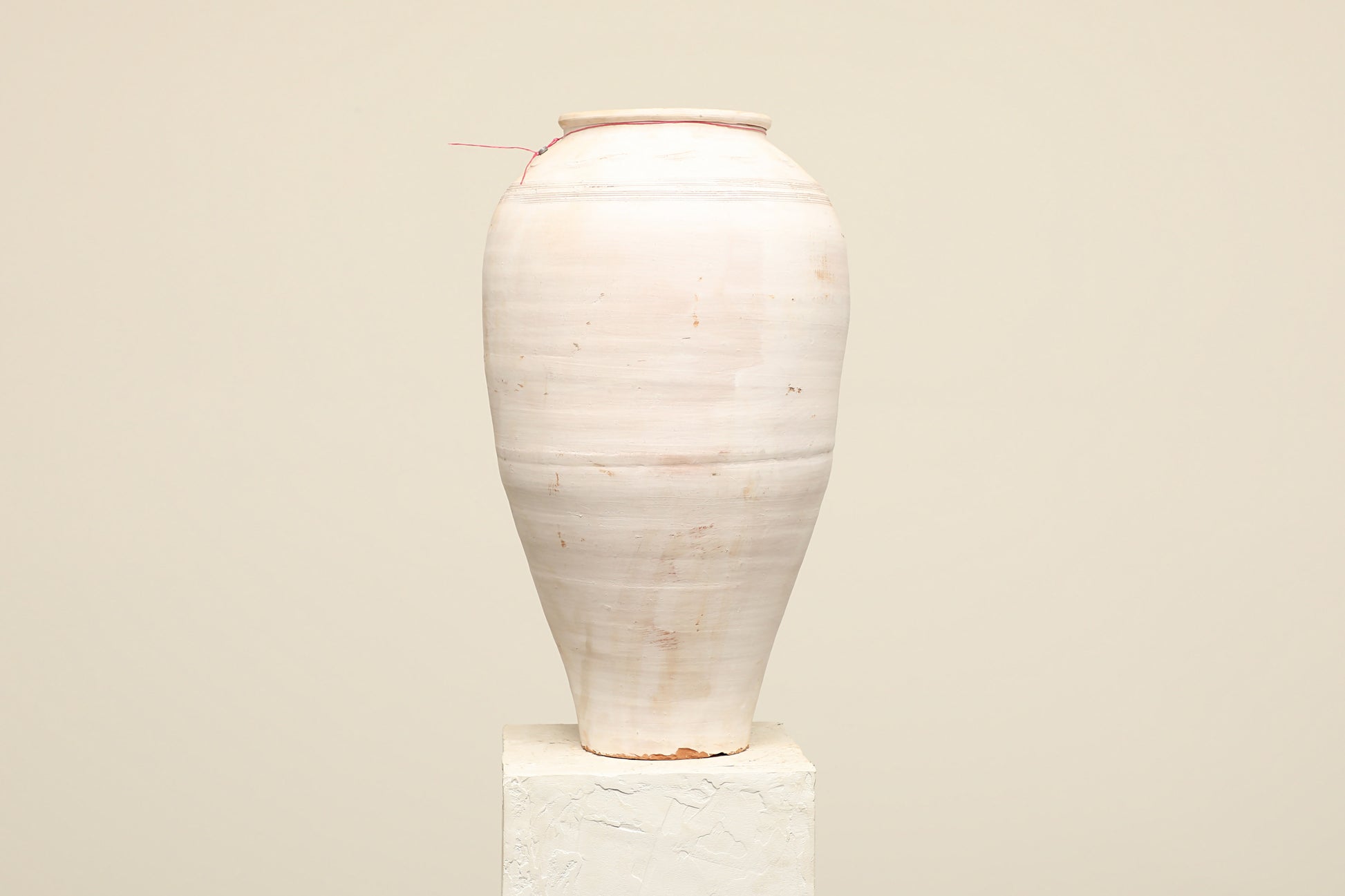 A one-of-a-kind white Turkish vintage vase pot without a handle, crafted from terra cotta clay, this piece showcases timeless quality and antique craftsmanship, adding a unique touch of history to your space