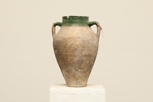 A one-of-a-kind clay brown Turkish vintage vase pot with two handles, crafted from terra cotta clay, this piece showcases timeless quality and antique craftsmanship, adding a unique touch of history to your space
