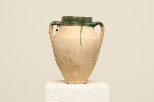 A one-of-a-kind clay brown Turkish vintage vase pot with two handles, crafted from terra cotta clay, this piece showcases timeless quality and antique craftsmanship, adding a unique touch of history to your space