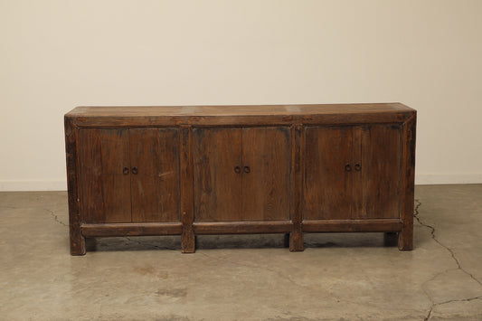 A one-of-a-kind, vintage rustic dark brown sideboard 3 cabinets handcrafted of elm natural wood in a farmhouse style, 85 inches long is narrow at 17 inches.