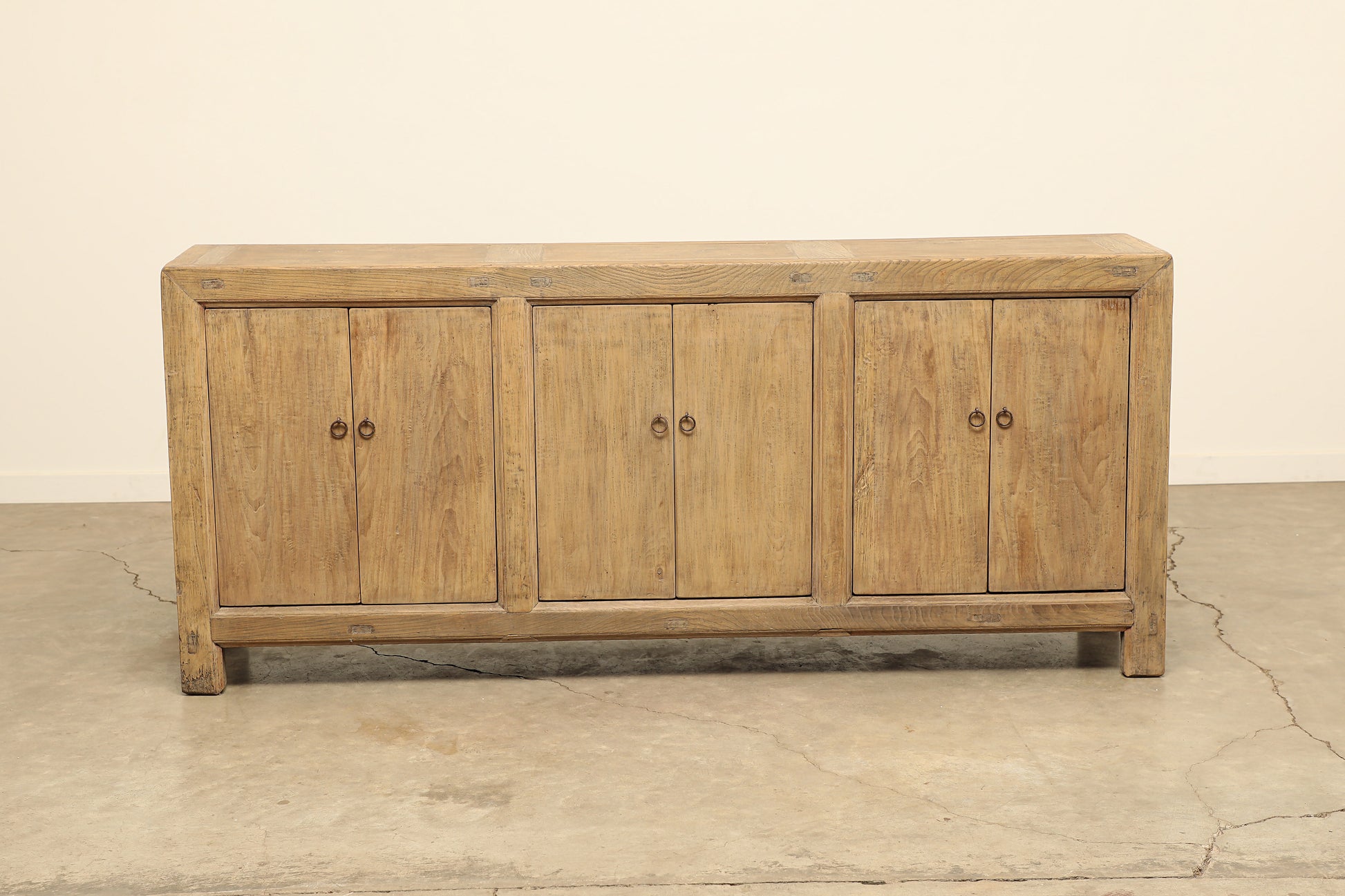 A one-of-a-kind, vintage rustic light brown sideboard 3 cabinets handcrafted of elm natural wood in a farmhouse style, 84 inches long is narrow at 17 inches.