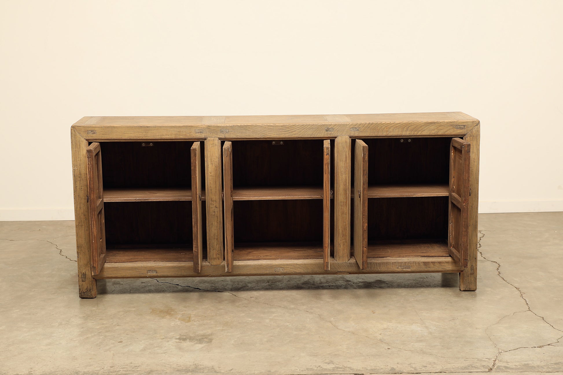 A one-of-a-kind, vintage rustic light brown sideboard 3 cabinets handcrafted of elm natural wood in a farmhouse style, 84 inches long is narrow at 17 inches.