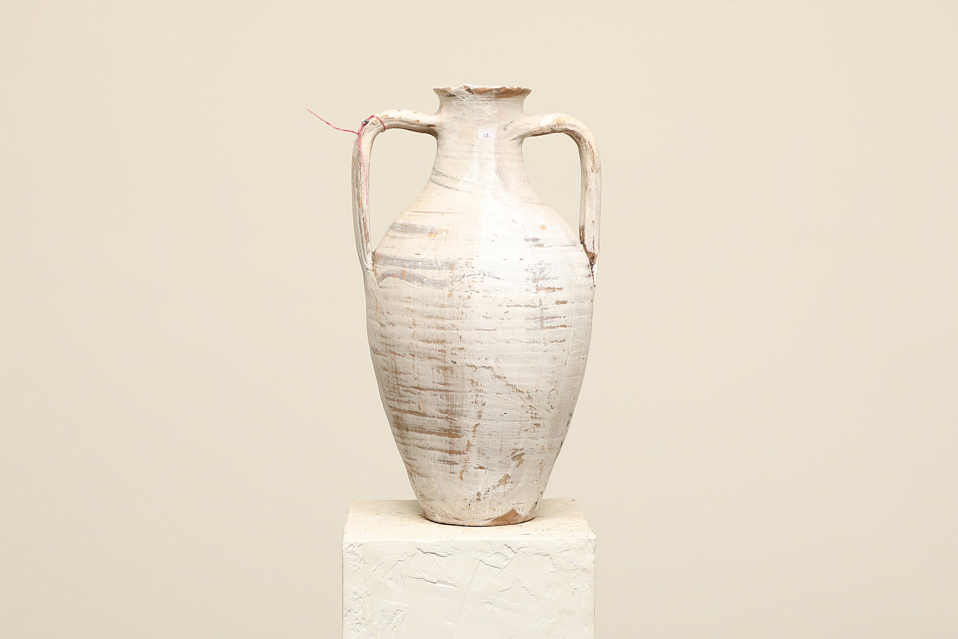 A one-of-a-kind white Turkish vintage vase pot with two handles, crafted from terra cotta clay, this piece showcases timeless quality and antique craftsmanship, adding a unique touch of history to your space