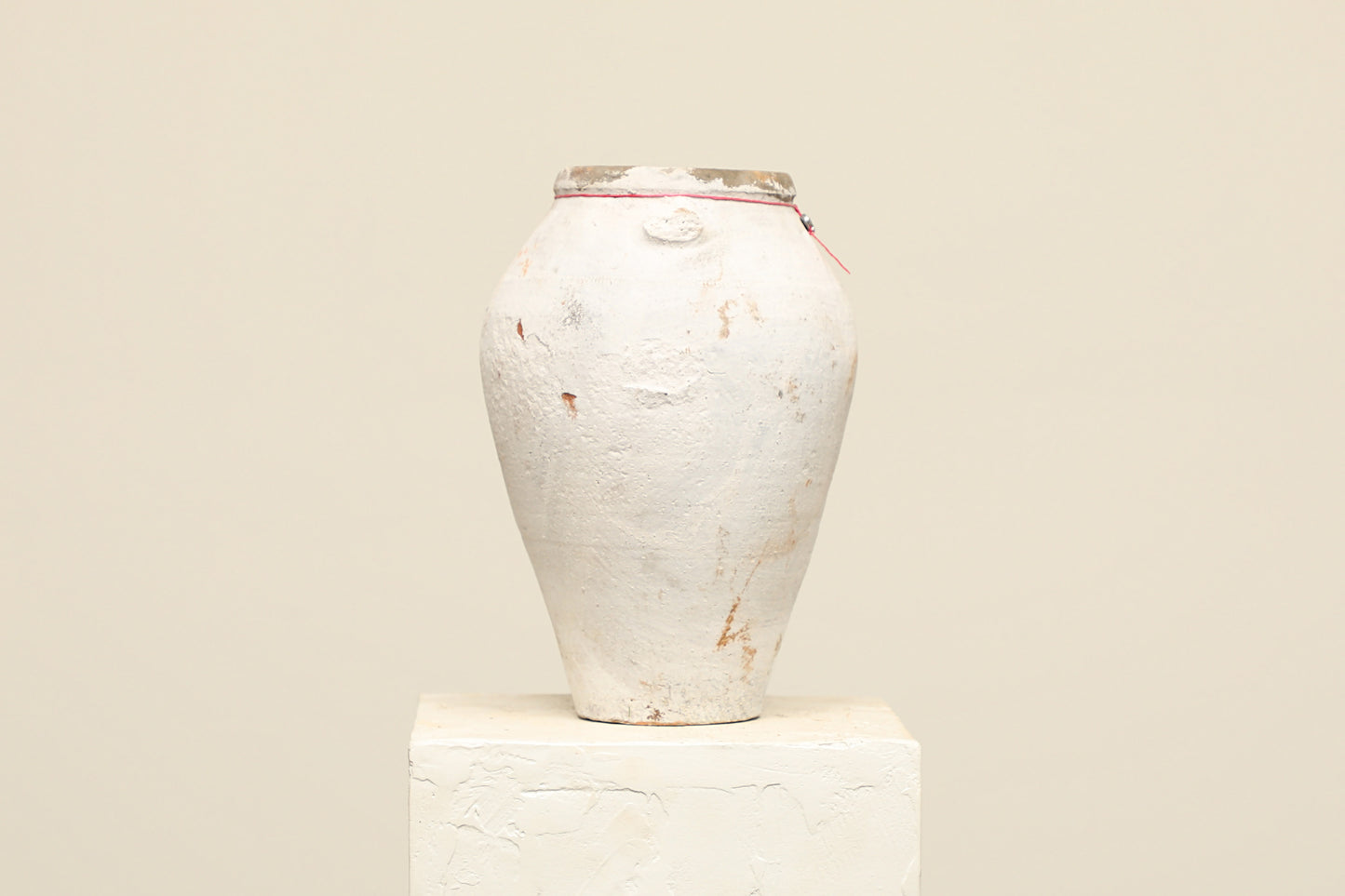 A one-of-a-kind white Turkish vintage vase pot without a handle, crafted from terra cotta clay, this piece showcases timeless quality and antique craftsmanship, adding a unique touch of history to your space