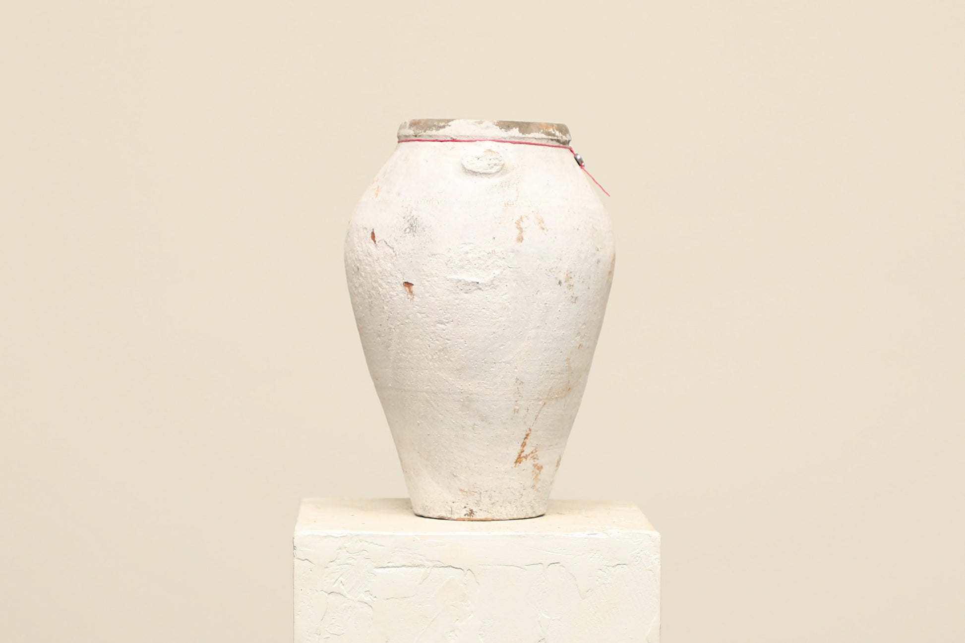 A one-of-a-kind white Turkish vintage vase pot without a handle, crafted from terra cotta clay, this piece showcases timeless quality and antique craftsmanship, adding a unique touch of history to your space