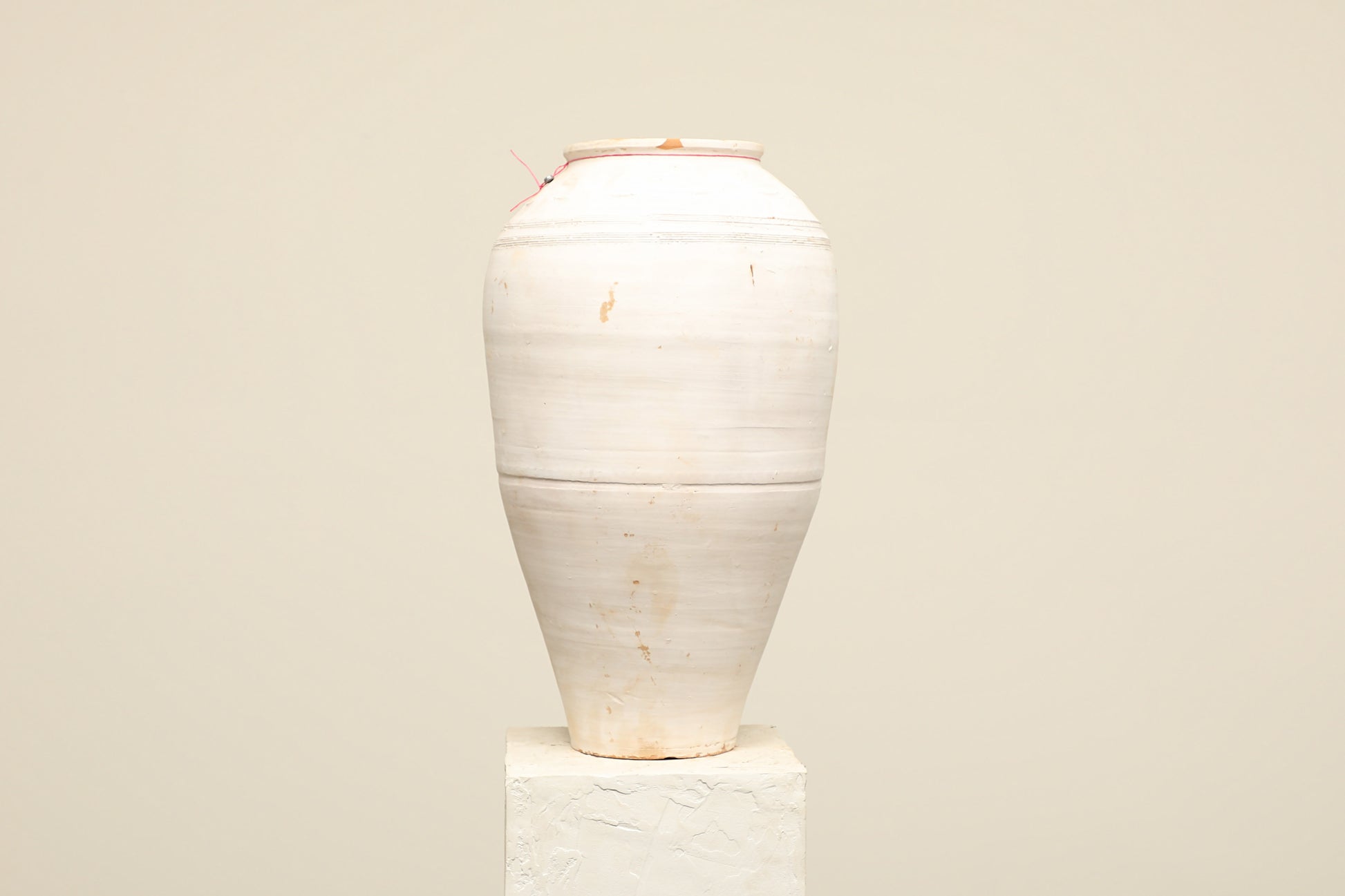 A one-of-a-kind white Turkish vintage vase pot without a handle, crafted from terra cotta clay, this piece showcases timeless quality and antique craftsmanship, adding a unique touch of history to your space