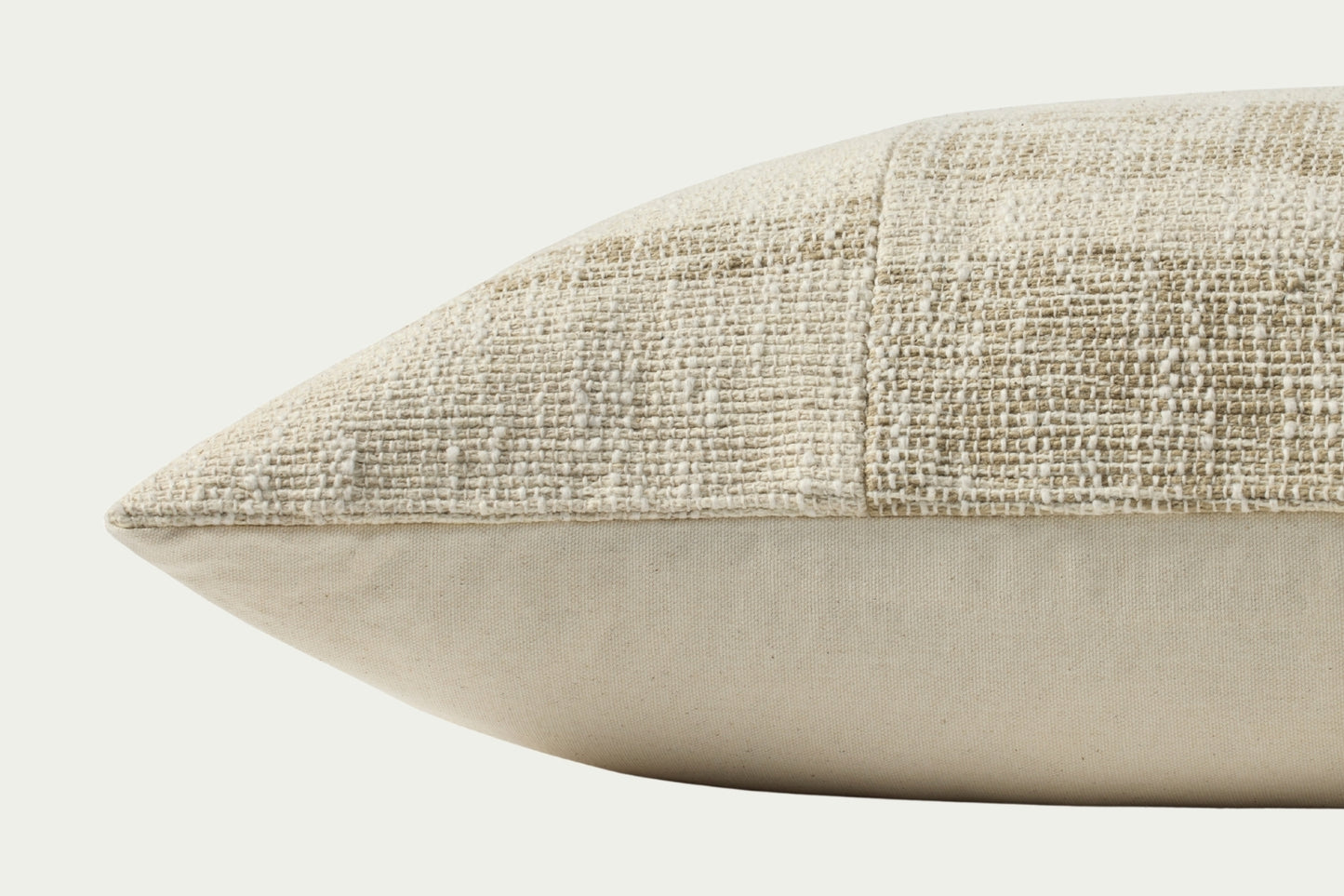 This modern lumbar throw pillow features a broken stripe pattern of neutral beige and cream with a gently heathered, woven texture. The pillow cover is 100% cotton and measures 16-inch by 26-inch, an elongated size to style in living rooms and bedrooms.