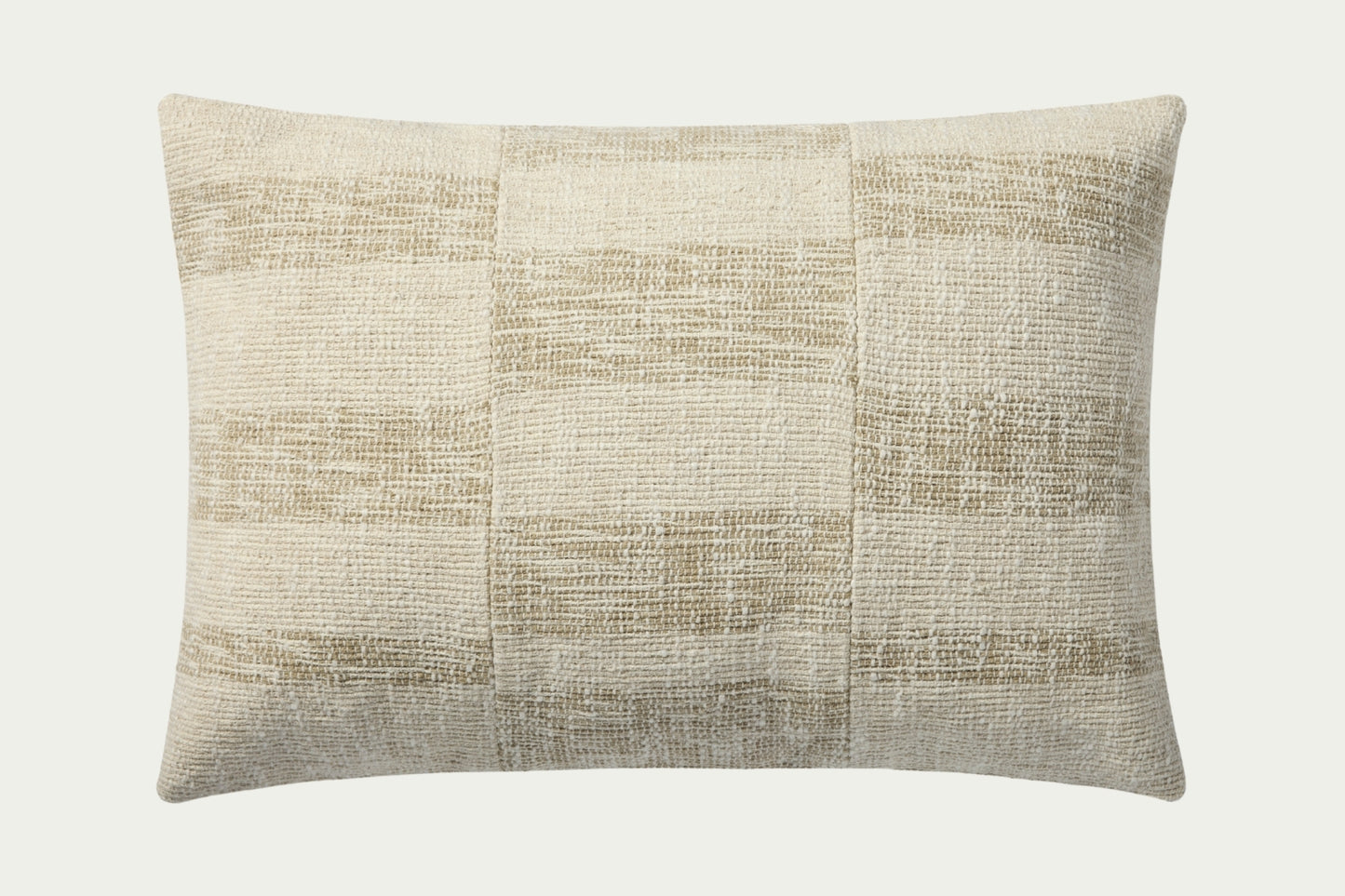 This modern lumbar throw pillow features a broken stripe pattern of neutral beige and cream with a gently heathered, woven texture. The pillow cover is 100% cotton and measures 16-inch by 26-inch, an elongated size to style in living rooms and bedrooms.