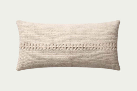 Neutral ivory lumbar throw pillow with a textured, woven stripe across its center, made of cotton, and other materials are 27 inches long by 12 inches tall.