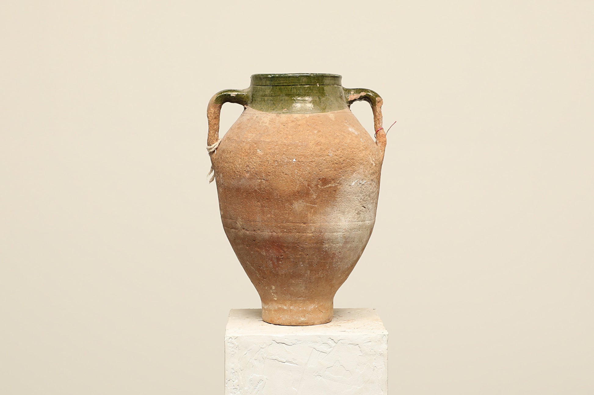 A one-of-a-kind dark brown Turkish vintage vase pot with two handles, crafted from terra cotta clay, this piece showcases timeless quality and antique craftsmanship, adding a unique touch of history to your space