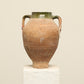 A one-of-a-kind dark brown Turkish vintage vase pot with two handles, crafted from terra cotta clay, this piece showcases timeless quality and antique craftsmanship, adding a unique touch of history to your space
