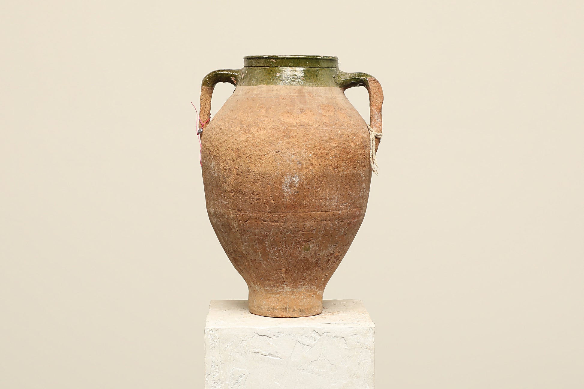 A one-of-a-kind dark brown Turkish vintage vase pot with two handles, crafted from terra cotta clay, this piece showcases timeless quality and antique craftsmanship, adding a unique touch of history to your space