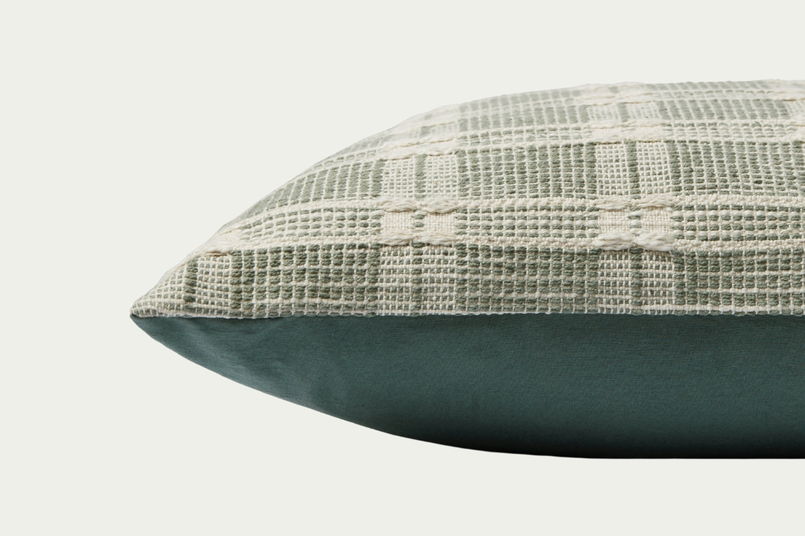 Add a subtle touch of sage green and visual texture with the handwoven Madera modern throw pillow, a 22-inch square accent pillow with cotton cover and feather down pillow insert.