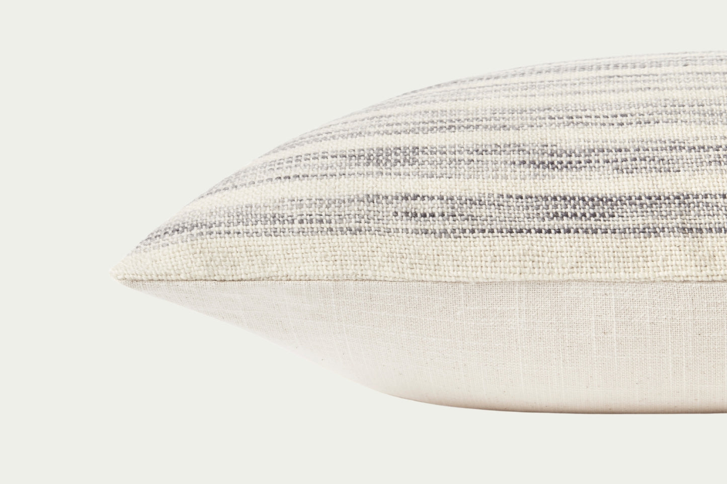 The Marielle Ivory and Stone Pillow features subtle stripes in neutral cotton and wool. A timeless design with a down feather insert, perfect for pairing with other accents.