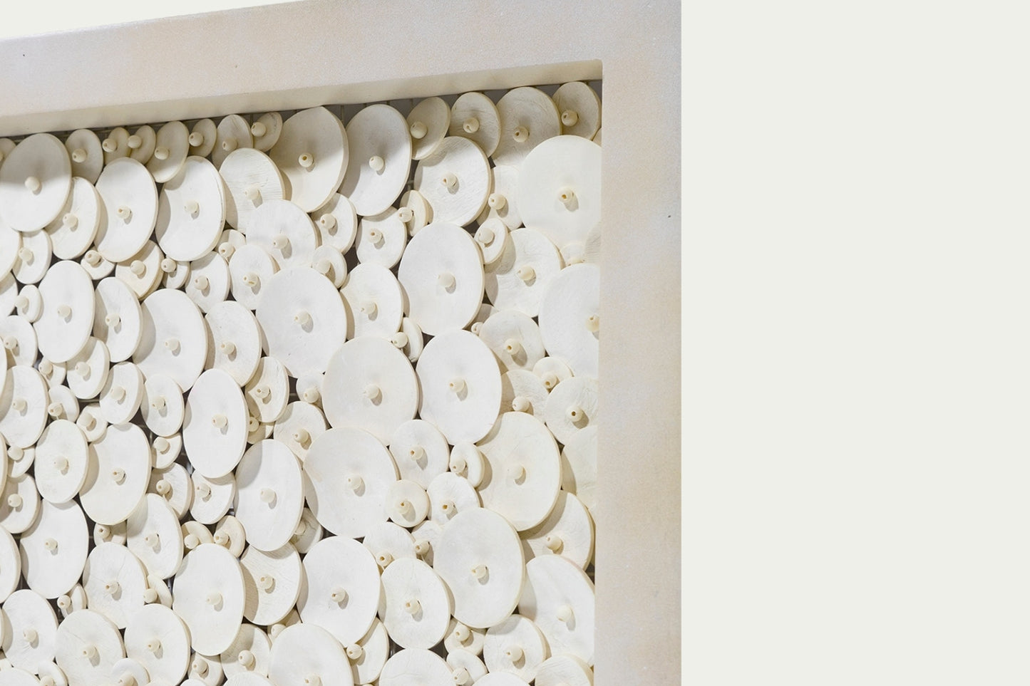 Amalia Coco wall art coastal home decor with coconut shell discs and beads neutral light wood frame