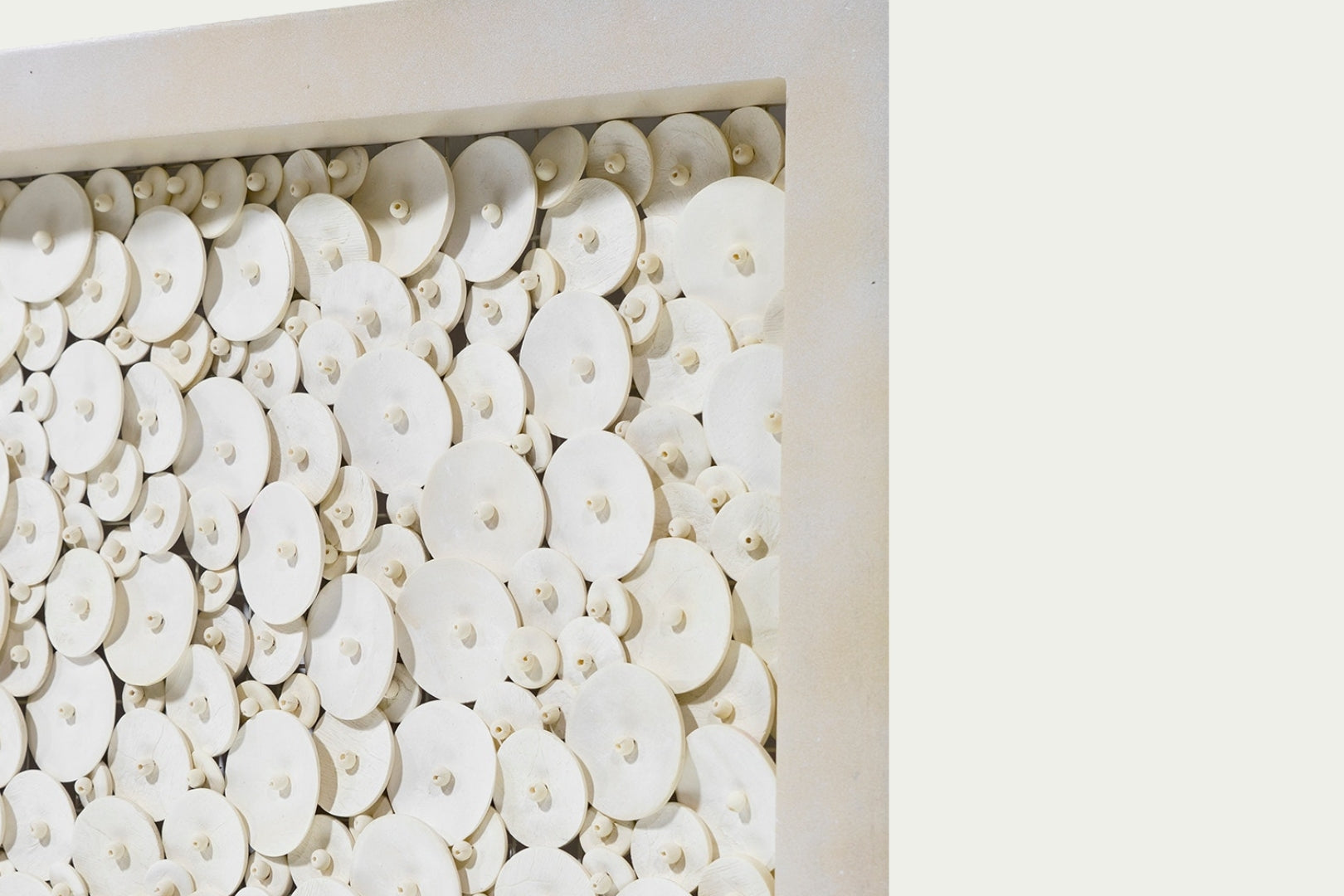 Amalia Coco wall art coastal home decor with coconut shell discs and beads neutral light wood frame