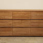 Add clean, timeless elegance to your bedroom with an 80-inch long 9-drawer teak wood dresser with ample storage space.